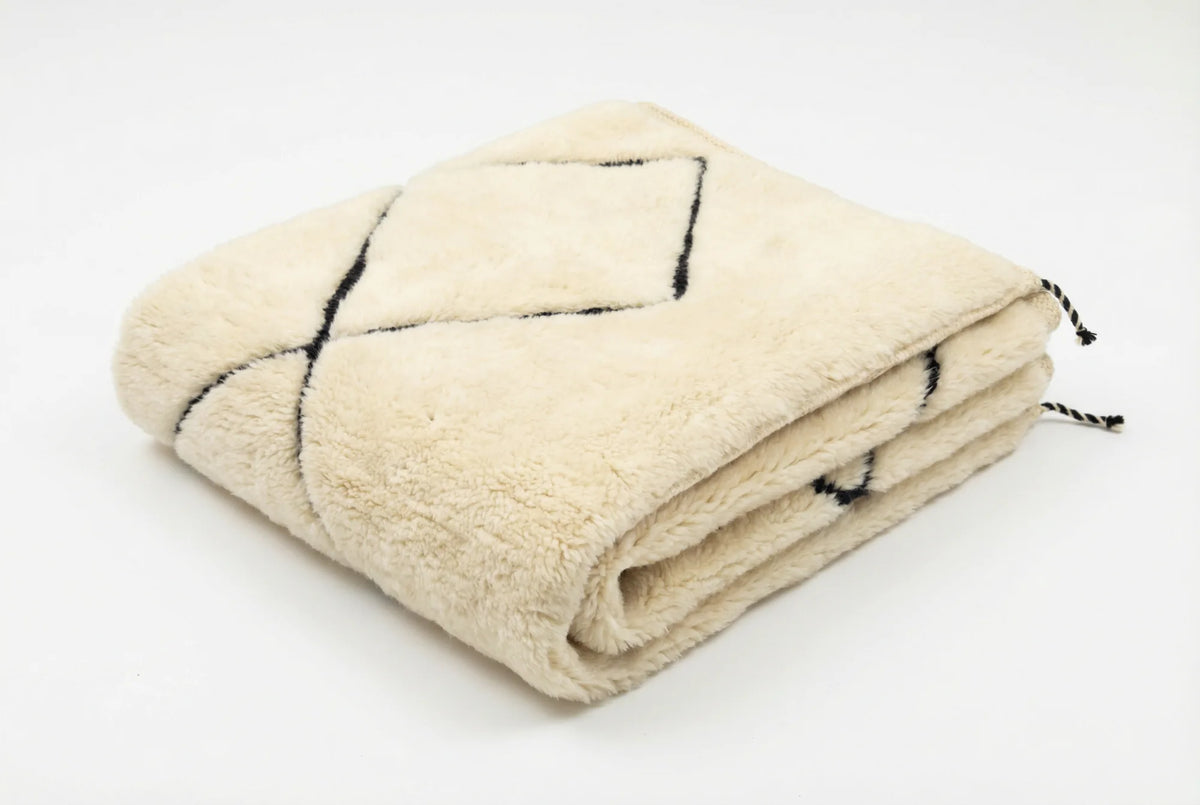 Beni Ourain wool rug, cream ground with two black diamonds, product view 3