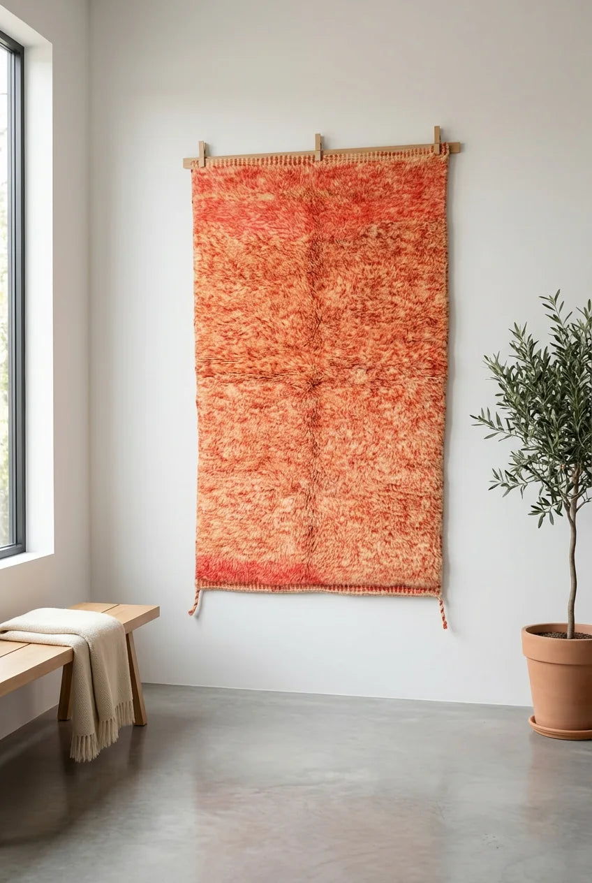 Detail of Moroccan wool rug, red ground with a lighter mottled texture