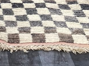 Fringe and edge detail of Black and Cream Vintage Moroccan Rug with Checkerboard Pattern, 280 × 193 cm.
