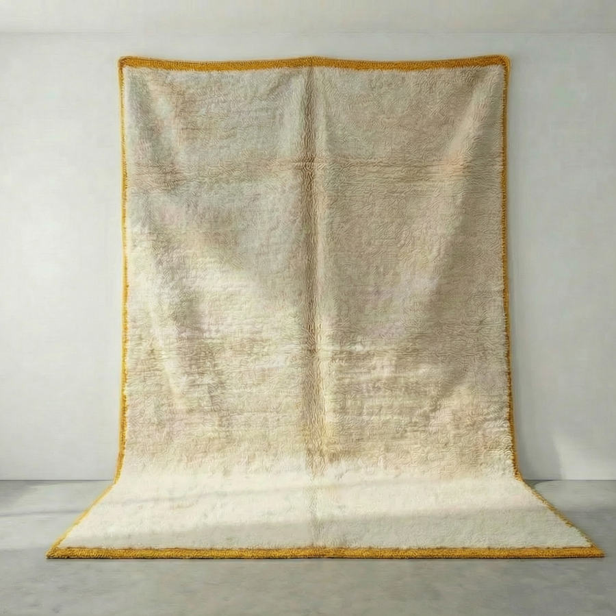 Detail of Mrirt wool rug, cream wool ground with a yellow border