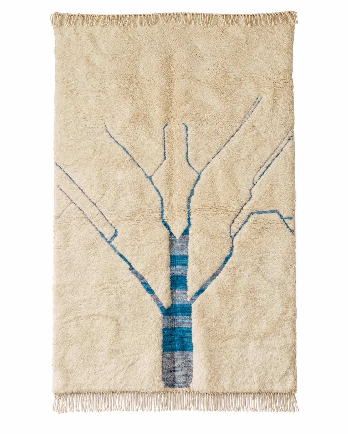 Mrirt wool rug, blue branching lines on a cream wool ground in a living room setting