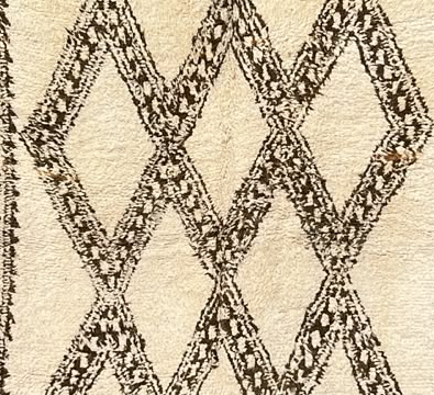 Detail of Cream Beni Ourain Rug with Broad Dark Diamonds, 256 × 170 cm.