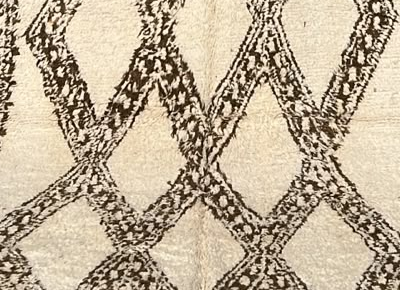 Detail of Cream Beni Ourain Rug with Broad Dark Diamonds, 256 × 170 cm.