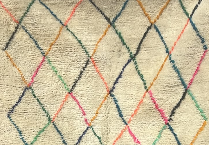 Detail of Small Cream Moroccan Rug with Colorful Diamond Grid, 160 × 110 cm.