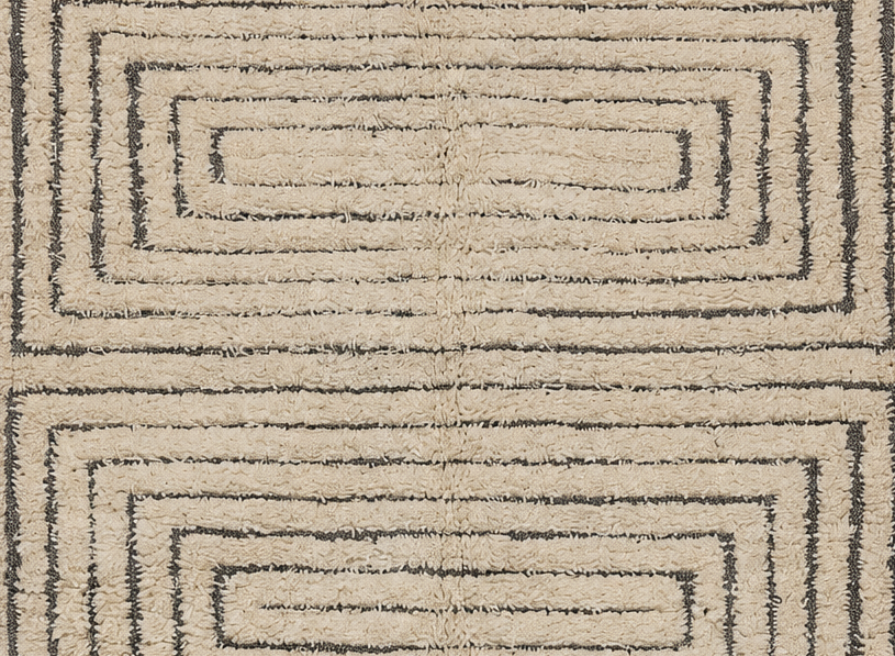 Detail of Cream Vintage Beni Ourain Rug with Three Dark Frames, 311 × 192 cm.