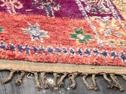 Fringe and edge detail of Purple Vintage Moroccan Rug with Light Symbol Rows, 277 × 186 cm.