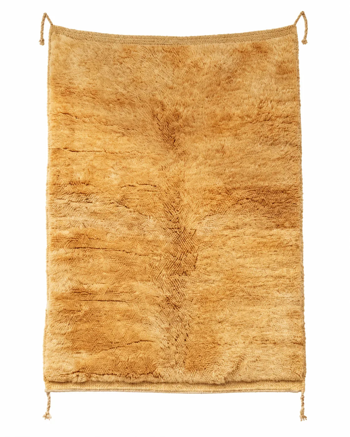 Moroccan wool rug, deep mustard yellow ground with fine vertical lines in the pile in a living room setting